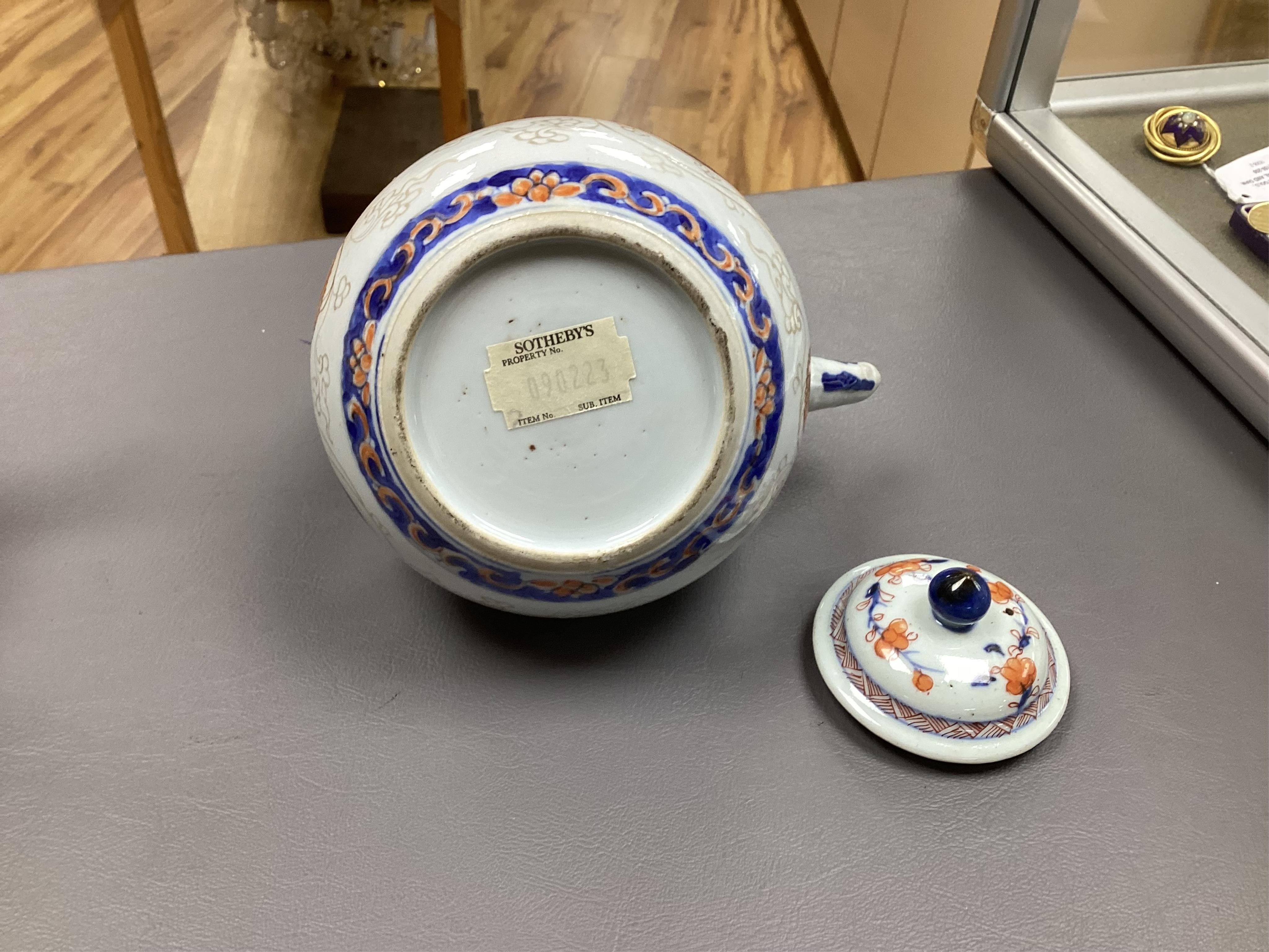 A Chinese famille rose ‘boys and ladies’ teapot, Qianlong period and a Japanese Arita sake pot or ewer, early 18th century, tallest 16cm high.